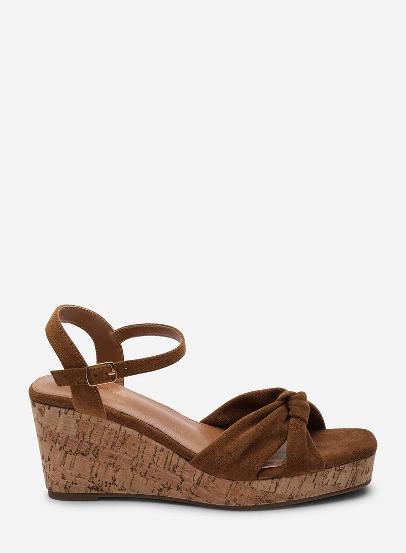من أين هذه Mystique Platform Knot Detail Cognac Suede Wedge