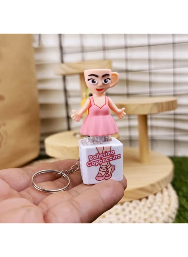 سلسلة مفاتيح راقصة الباليه وكوب الكابتشينو - لمسة ساحرة مع بريق وصوت! راقصة باليه برأس كوب كابتشينو! تُصدر صوتًا لطيفًا عند الضغط عليها. تتميز بإضاءة مبهجة. تصميم عصري، خفيفة الوزن (طولها 6.5 سم فقط). هدية مثالية لأعياد الميلاد، وعيد الميلاد المجيد، ومناسبة لمحبي القهوة. - Image 1