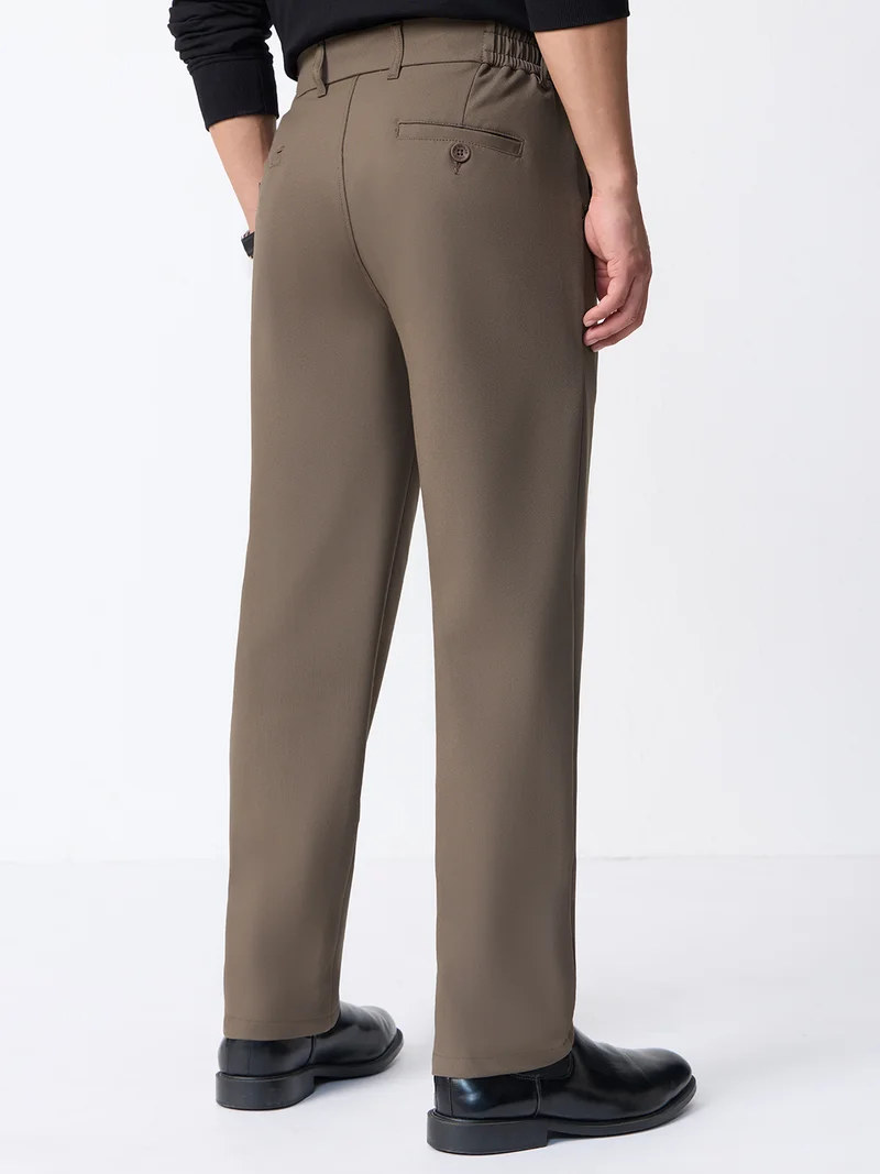 The Souled Store  The Souled Store Super Flex Pants: Men and Boys Sienna Brown Solid Polyester Viscose Elastane Blend Straight Fit Elastic Back Waistband Pleated Front Trousers  | Best Price UAE