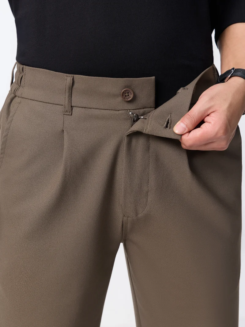 The Souled Store  The Souled Store Super Flex Pants: Men and Boys Sienna Brown Solid Polyester Viscose Elastane Blend Straight Fit Elastic Back Waistband Pleated Front Trousers  | Best Price UAE