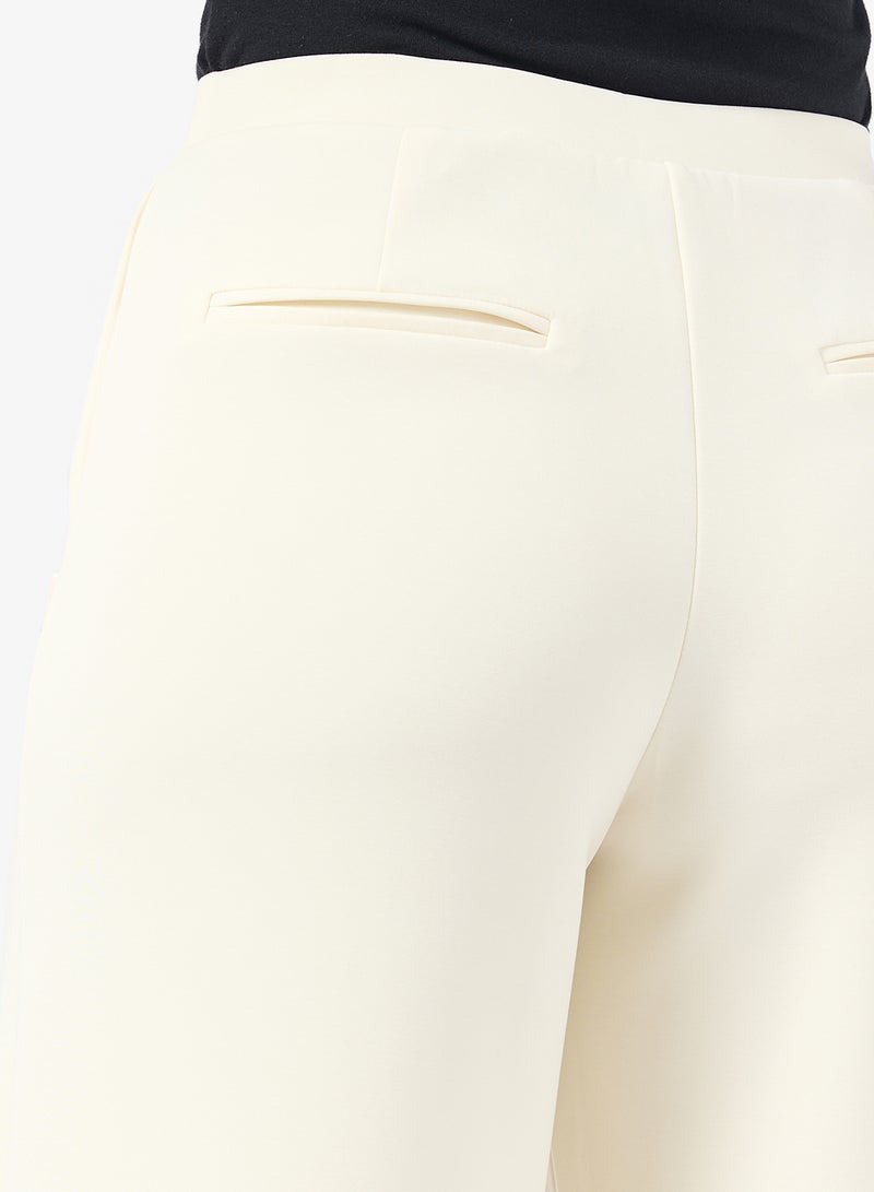 بنطلون واسع الساق بخصر مرتفع وشعار