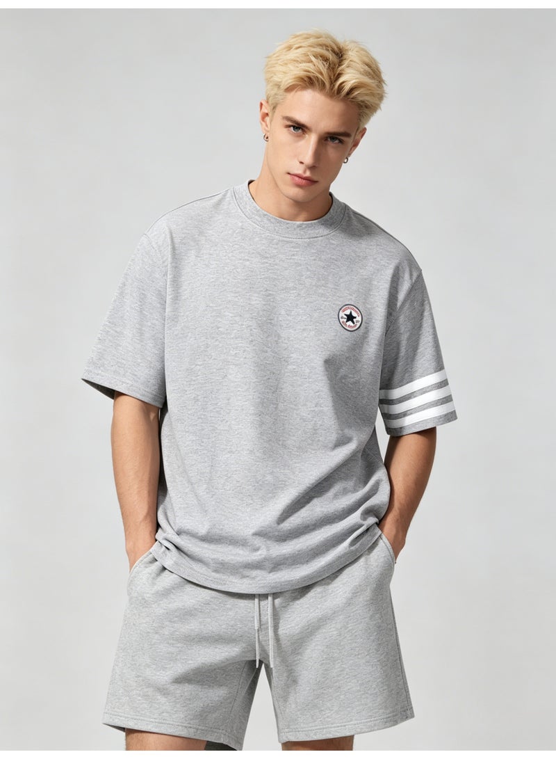 كونفرس Converse Men’s Heather Grey Crew Neck Short Sleeve Tee with Circular Star Logo & Three White Sleeve Stripes - Image 1