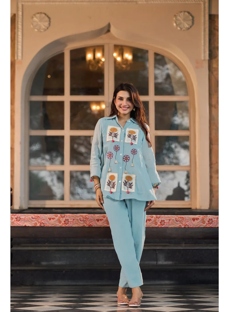 Powder Blue Cotton Crush Co-Ord Set for Women with Floral Embroidery & Schiffli Net Detailing | Shirt Collar Top with 3/4 Sleeves & Straight Pants | Indian Ethnic Wear | Kurti Set | Smart Casual & Brunch Wear