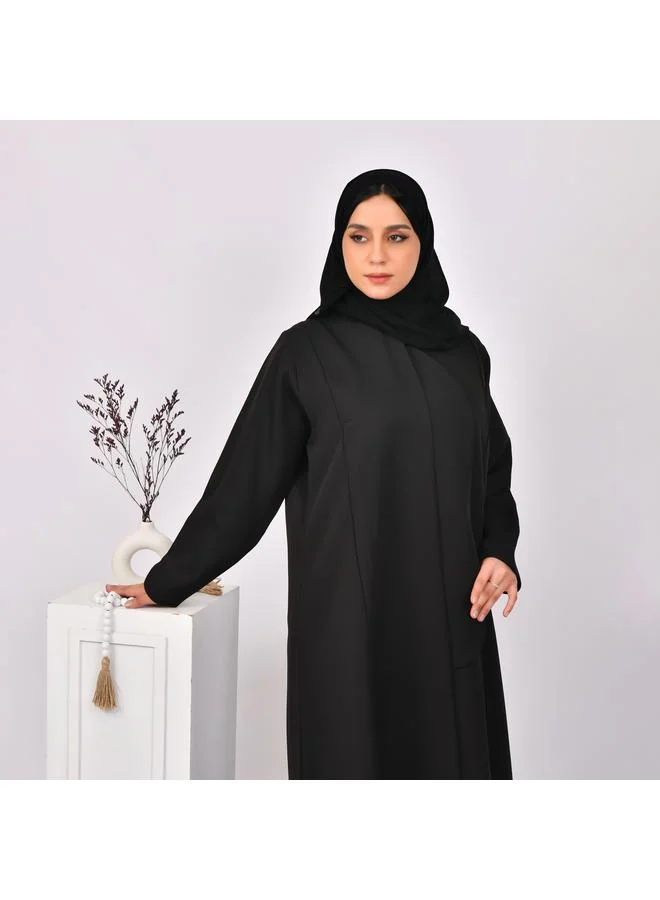 HAWRAA ABAYA Black abaya with formal design and side piece that closes with hidden buttons