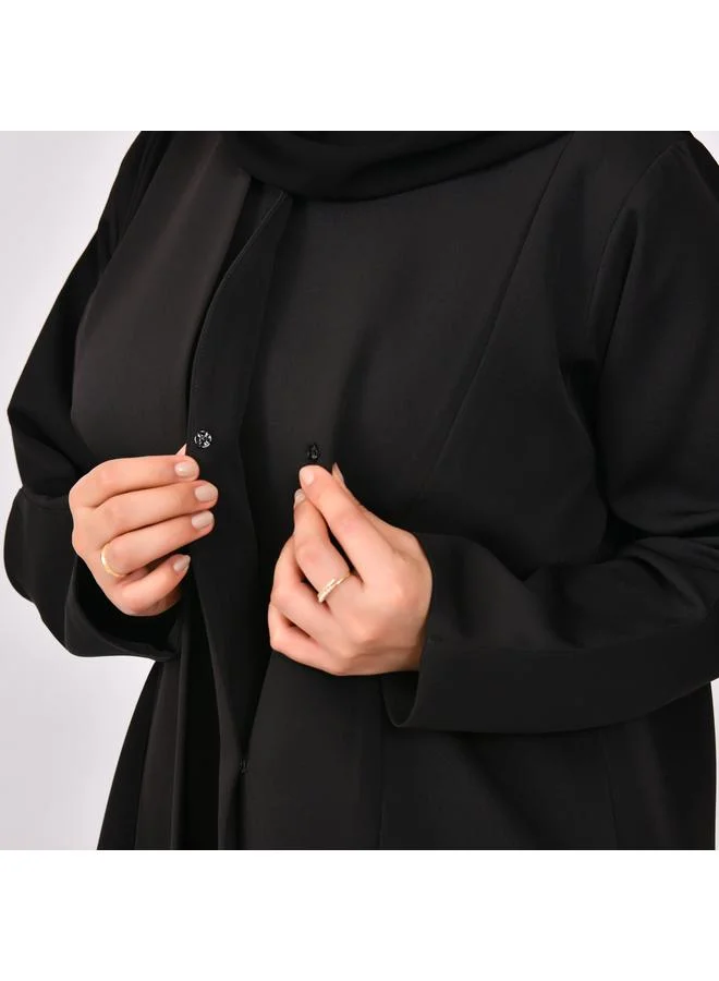 HAWRAA ABAYA Black abaya with formal design and side piece that closes with hidden buttons