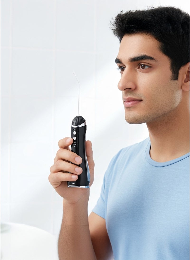 جهاز تنظيف الأسنان بالماء بتصميم محمول مع 4 أنابيب أسود - Image 1