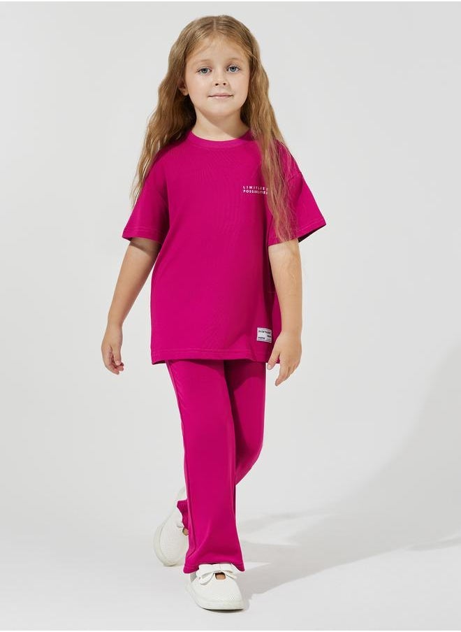Styli Slogan Print Oversized T-Shirt & Flared Pants Set  - Image 1