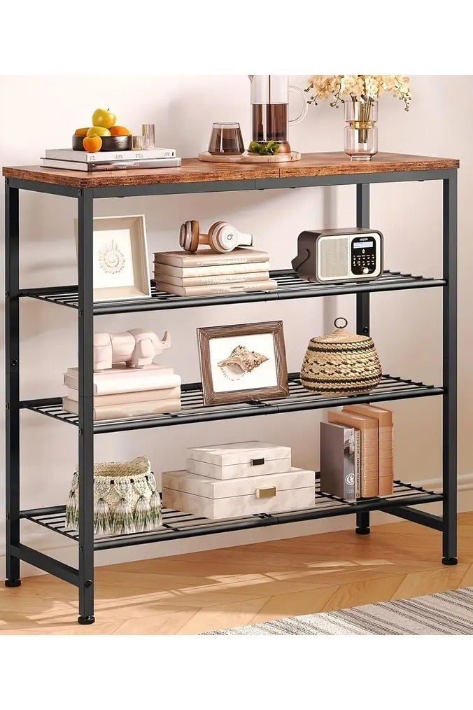 Generic A shoe cabinet with a modern rustic design to organize your shoes. It consists of 4 shelves, 3 metal shelves and a wooden upper shelf. The storage space is spacious to meet the family's needs in organizing all shoes or high-neck boots. It may be an organizer for antiques or photos, for example. It is used at the entrance of the house or apartment. You can benefit from the wooden tabletop to place a tray for your keys, wallet, pocket umbrella, mail, or to place your plant, a small fish tank, an air freshener, or an incense burner. It is characterized by its modern and elegant design in wood and black metal, which gives it a distinctive appearance. It is manufactured using high-quality wood and metal materials, which makes it durable and sustainable for daily use. It is easy to install, and the table feet are adjustable to maintain balance. The table is 72 cm long, 28 cm wide, and 69 cm high. - Image 2