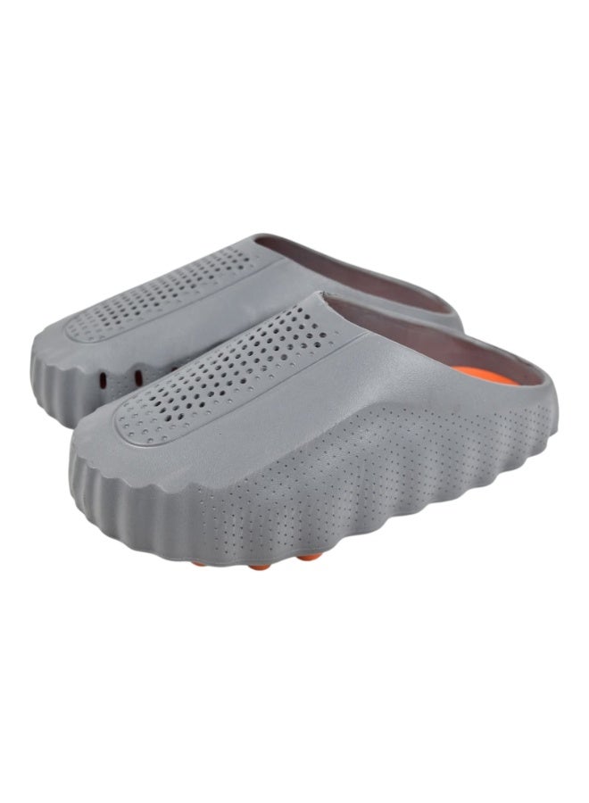 A sleek and comfortable closed-toe slide sandal designed with a unique wave-textured side profile and top ventilation holes, ensuring maximum breathability and cushioned comfort for daily wear.