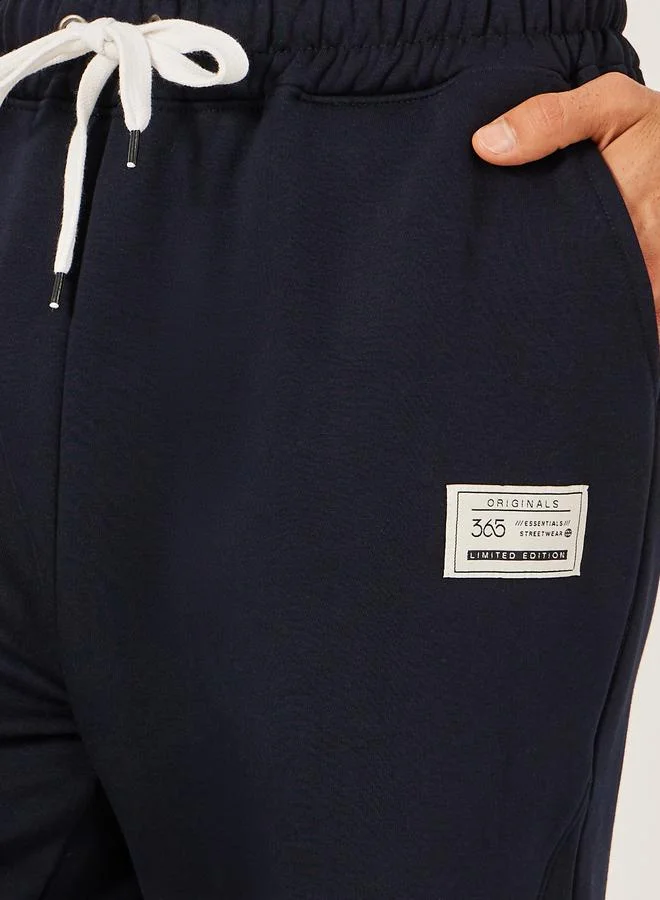 Styli Styli Badge Detail Fleece Panelled Joggers with Drawstring