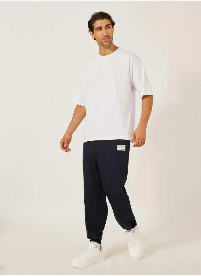 ستايلي Styli Badge Detail Fleece Panelled Joggers with Drawstring