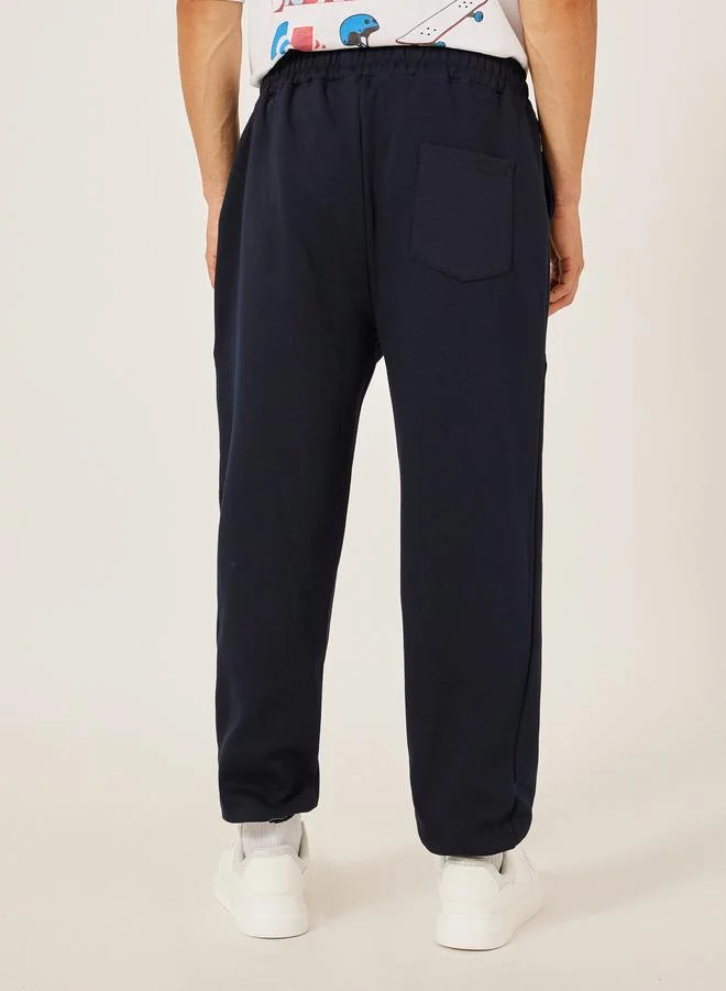 Styli Styli Badge Detail Fleece Panelled Joggers with Drawstring