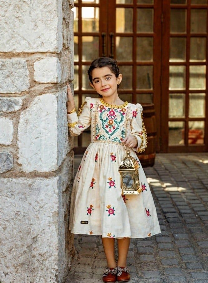 An elegant girls' dress made of the finest fabrics to suit your little girl's softness and make her elegant with her beautiful look.  - Image 1