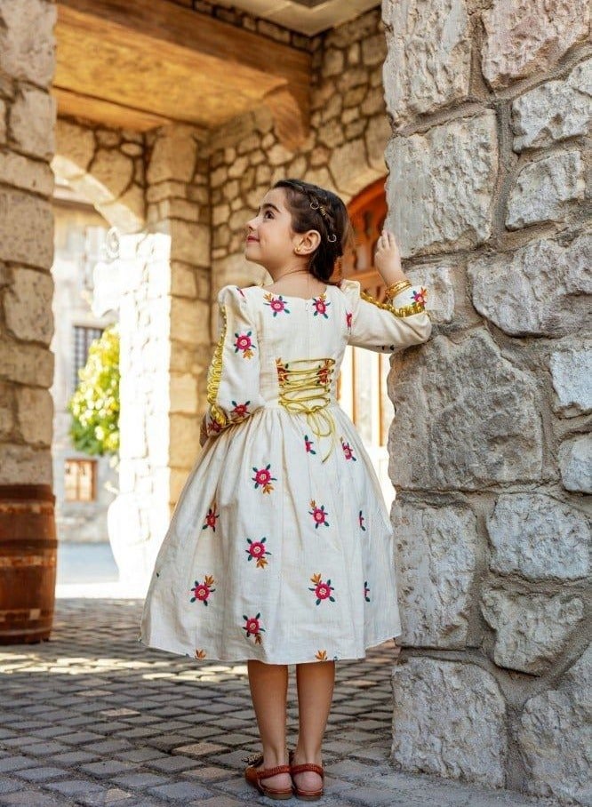 An elegant girls' dress made of the finest fabrics to suit your little girl's softness and make her elegant with her beautiful look.  - Image 2
