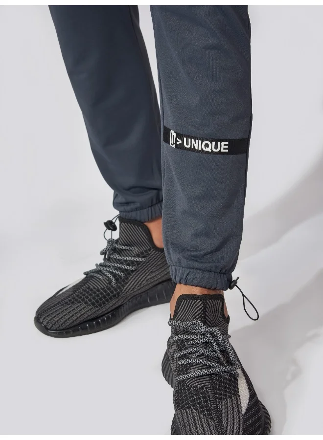 Maniac Maniac Men Printed 95% Polyester 5% Lycra French Terry fabric Dark Grey Slim Fit Trackpant