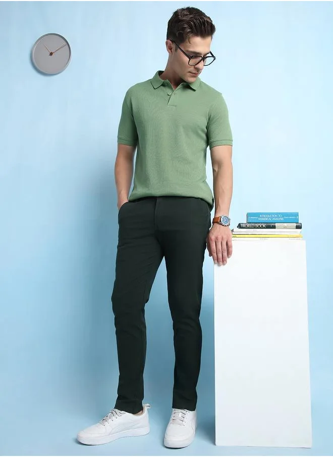 Dennis Lingo Trendy Olive Green Slim Fit Chinos for Men with a solid pattern, mid-rise waist, and a premium cotton-lycra blend for a perfect balance of style and comfort.