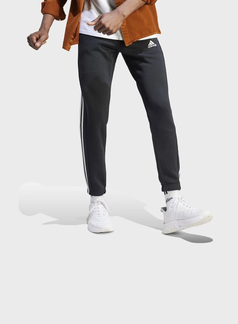 adidas بنطال Essentials Fleece 3-Stripes Tapered Cuff
