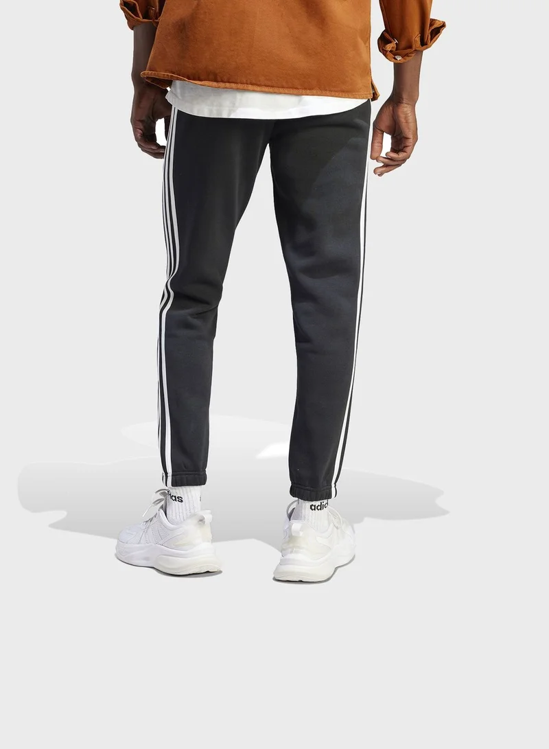adidas بنطال Essentials Fleece 3-Stripes Tapered Cuff