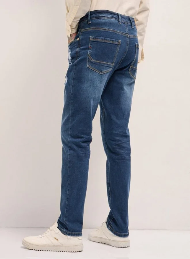 The Bear House  Men's Mid Blue with Light Fade Distressed Mid-Rise Slim Fit Jeans Classic Comfort With Modern Style, Perfect For Everyday Casual Looks And Effortless Streetwear Vibes for Men | Best Price UAE