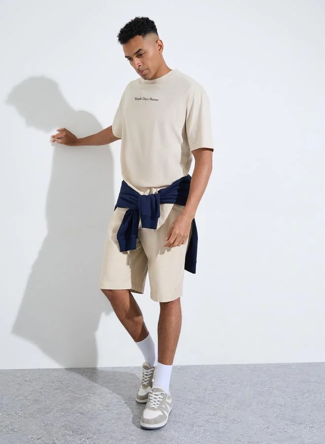 Styli Beige Slogan Print Crew Neck Oversized T-Shirt