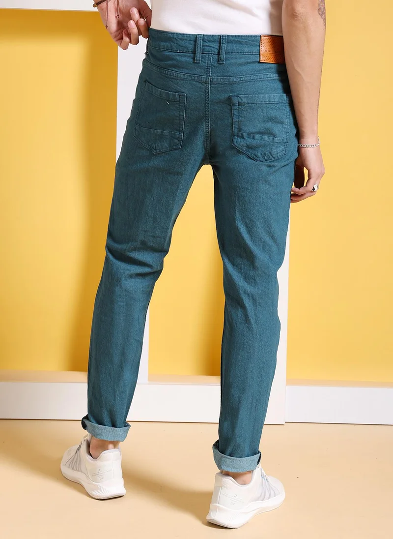 ذا انديان كراج كو Men Slim Fit Solid Mid-Rise Stretchable Jeans