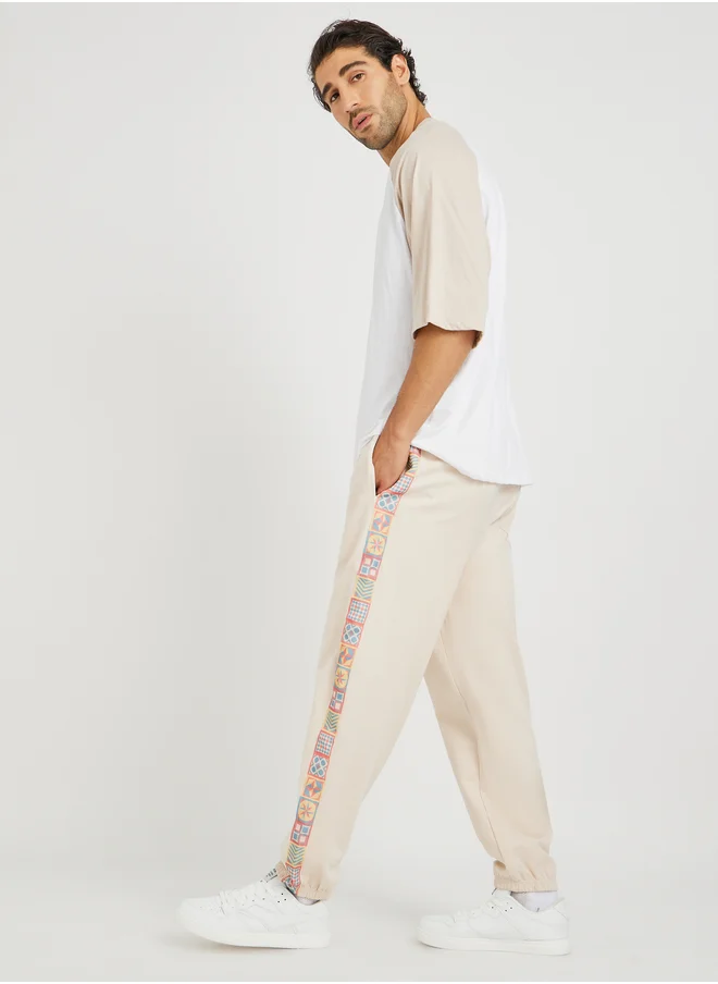 Styli Side Motif Printed Tape Relaxed Fit Joggers