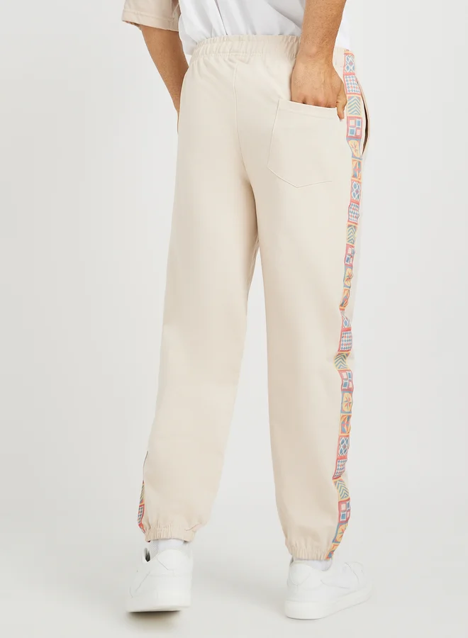 Styli Side Motif Printed Tape Relaxed Fit Joggers