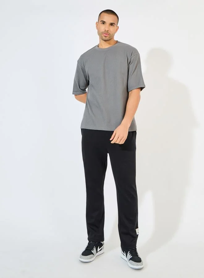 Styli Waffle Knit Oversized T-Shirt with Turn-Up Sleeve