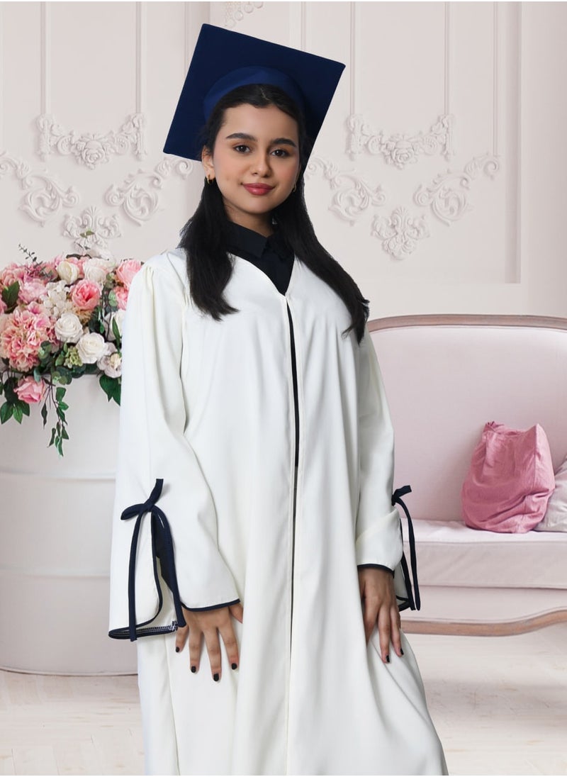 HAWRAA ABAYA - Graduation uniform: white abaya with wide open sleeves, decorated with a bow, with a plain scarf and cap, in dark navy blue - Image 1