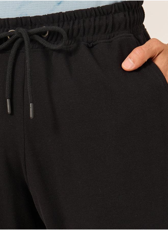 Styli - Slim Fit Pique Knit Pants with Turn-Up Hem - Image 1