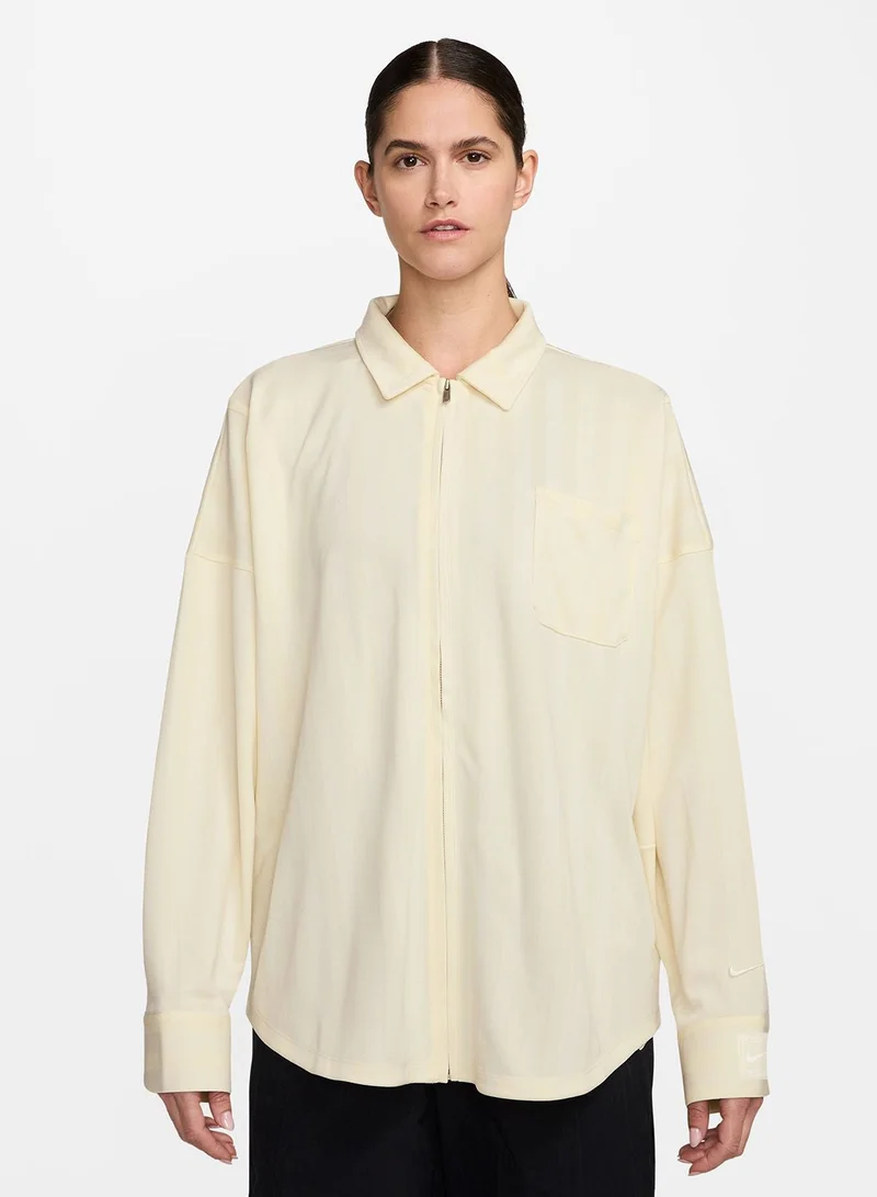 نايكي قميص بأزرار بنقش الجاكار المخطط