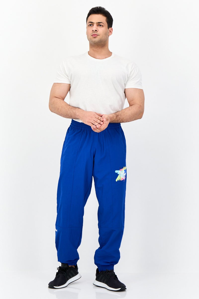 adidas Originals Men Sportswear Fit Printed Outdoor Track Pants, Royal Blue - Image 4