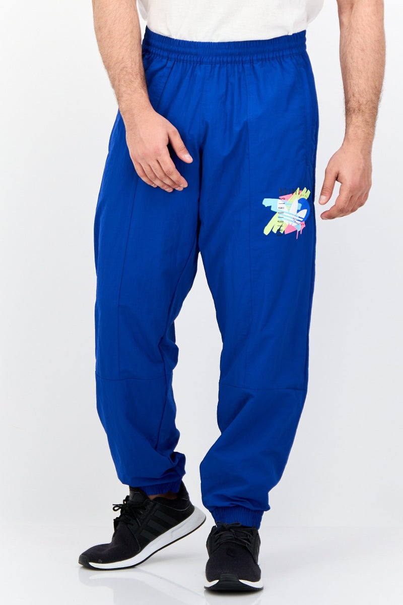 adidas Originals Men Sportswear Fit Printed Outdoor Track Pants, Royal Blue - Image 1