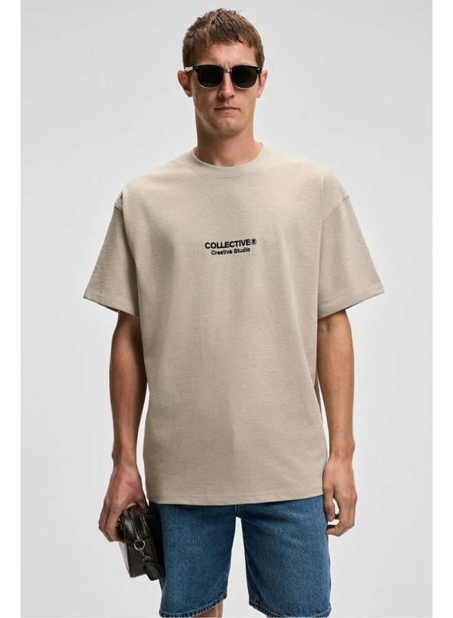 GRIMELANGE COLLECTIVE Men's Front Embroidery Back Print Detailed %100 Organic Cotton Oversized Short Sleeve Stone Color T-Shirt.
