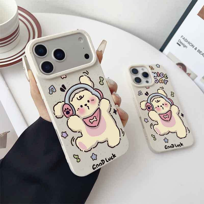 Apple iPhone 17 Pro Max phone case with a cartoon puppy design and earphones - a shockproof soft case - Image 1