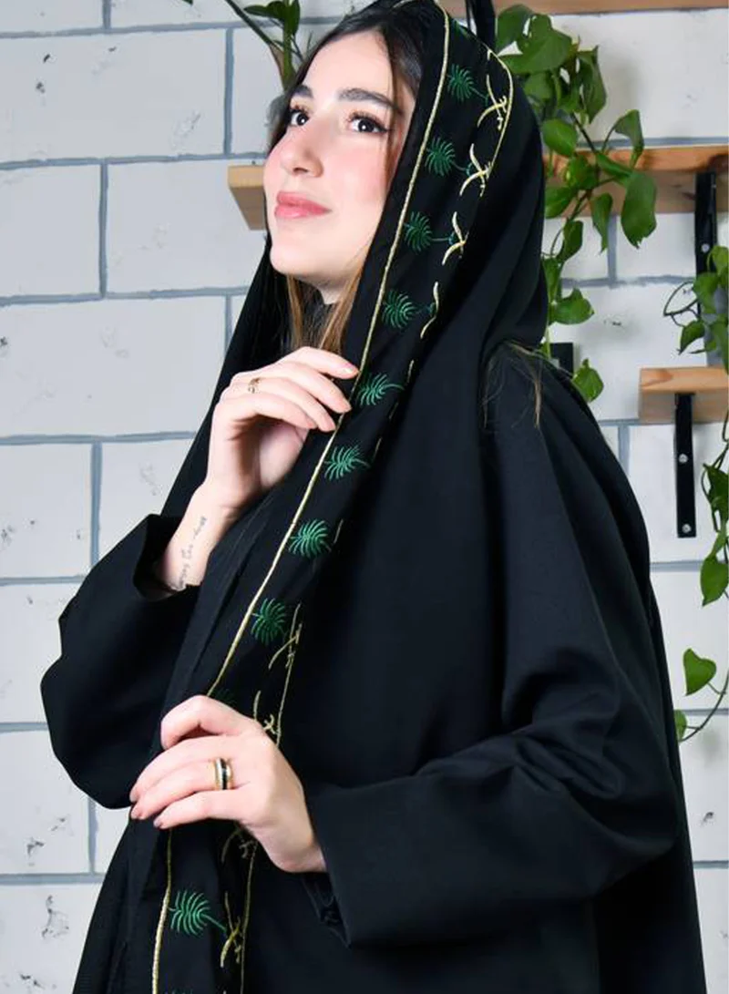 HAWRAA ABAYA A black silk scarf with the country's emblem embroidered in traditional colors