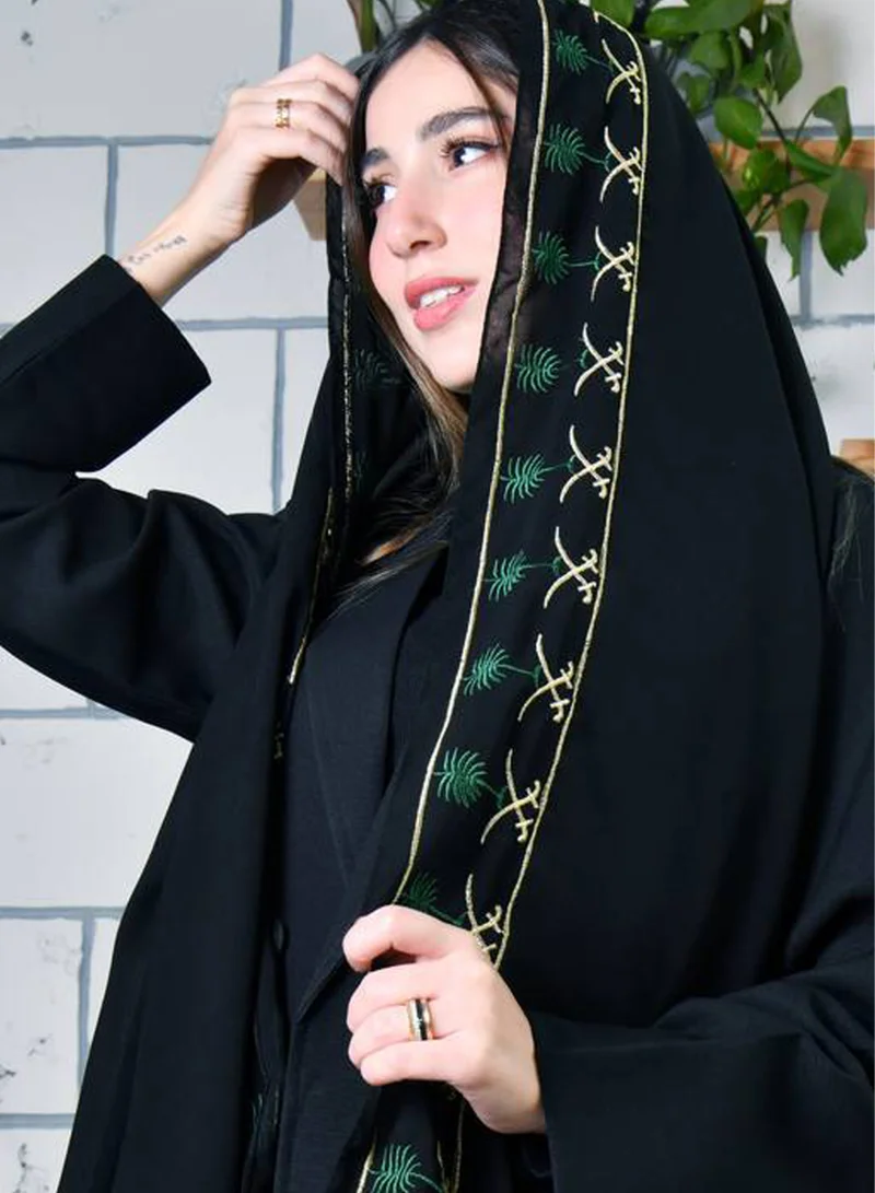 HAWRAA ABAYA A black silk scarf with the country's emblem embroidered in traditional colors
