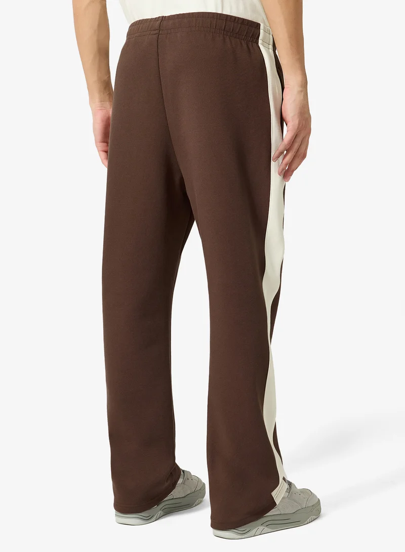 Karl Kani  Signature Sidestripe Pique Trackpants for Men | Best Price UAE