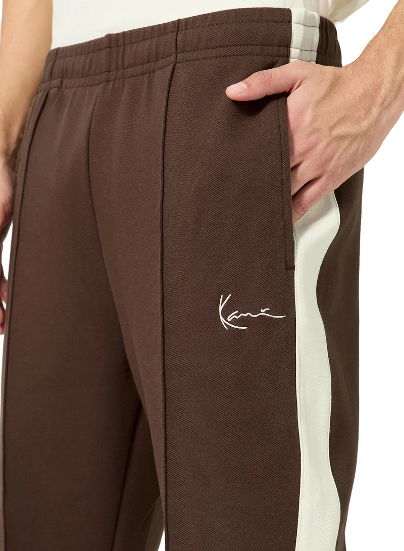 Karl Kani  Signature Sidestripe Pique Trackpants for Men | Best Price UAE