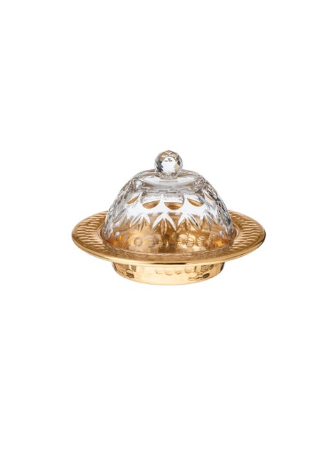 Dates and sweets bowl consisting of a metal plate with a glass cover