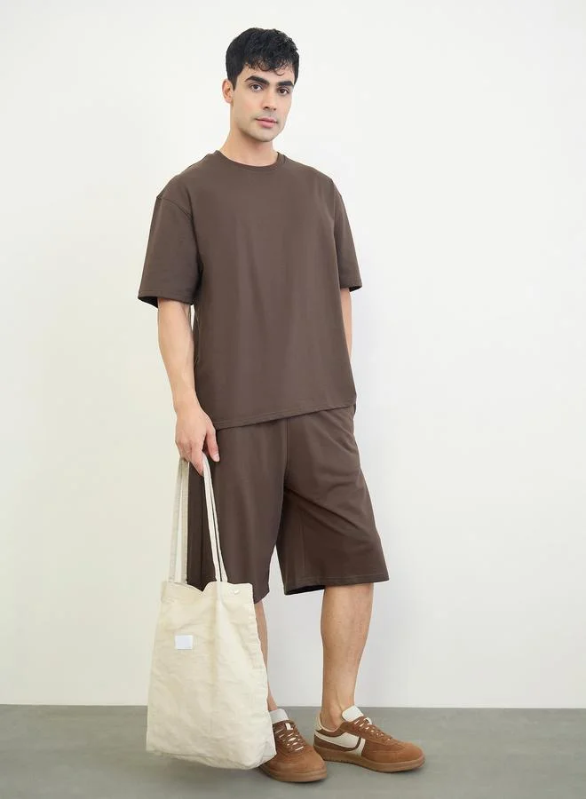 Styli Men Slogan Print Oversized T-Shirt and Shorts Set
