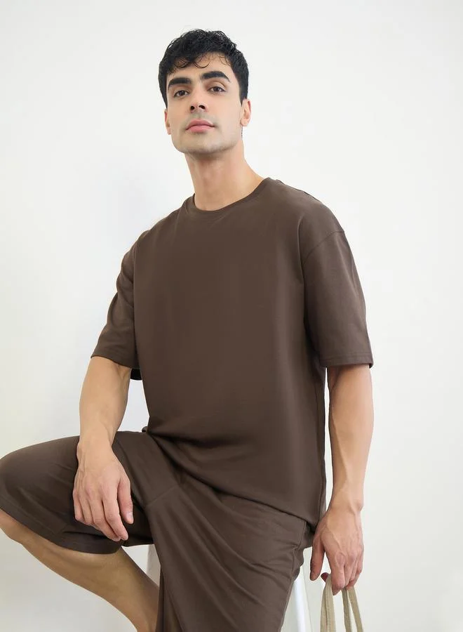 Styli Men Slogan Print Oversized T-Shirt and Shorts Set