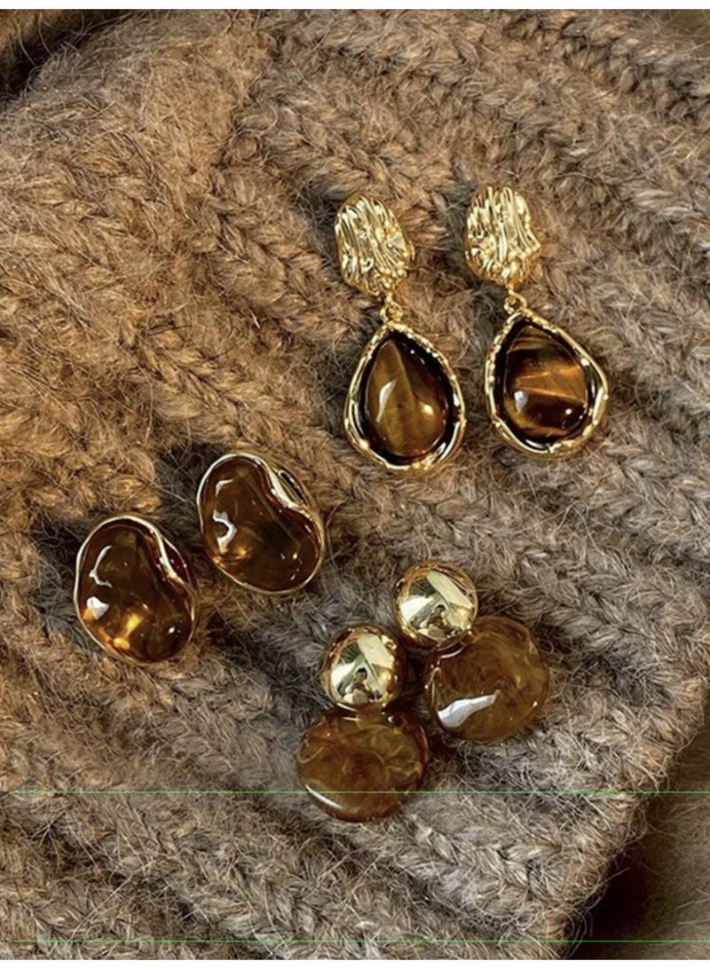 3 pairs of elegant  resin earrings with amber-colored accents for women, suitable for everyday wear, evenings, and parties. - Image 1