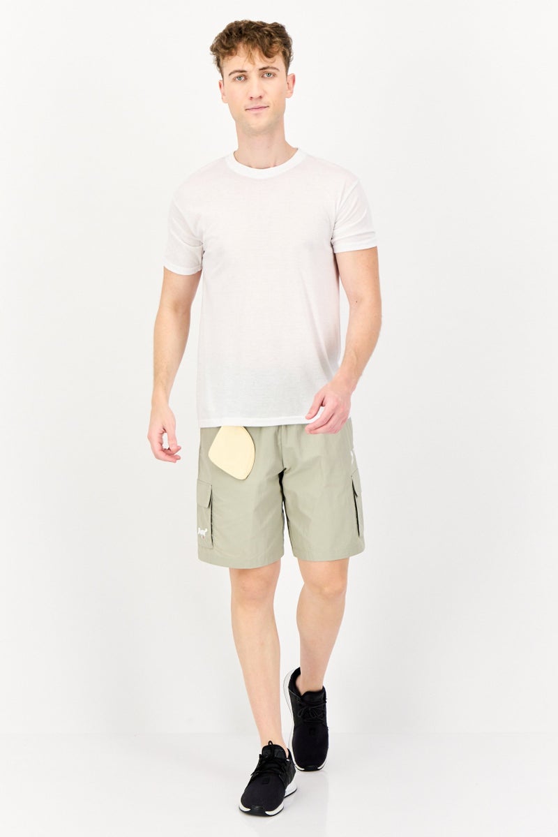 PUMA شورتات جري للرجال بقصة مريحة مع شعار مطرز وحقيبة، كاكي - Image 3