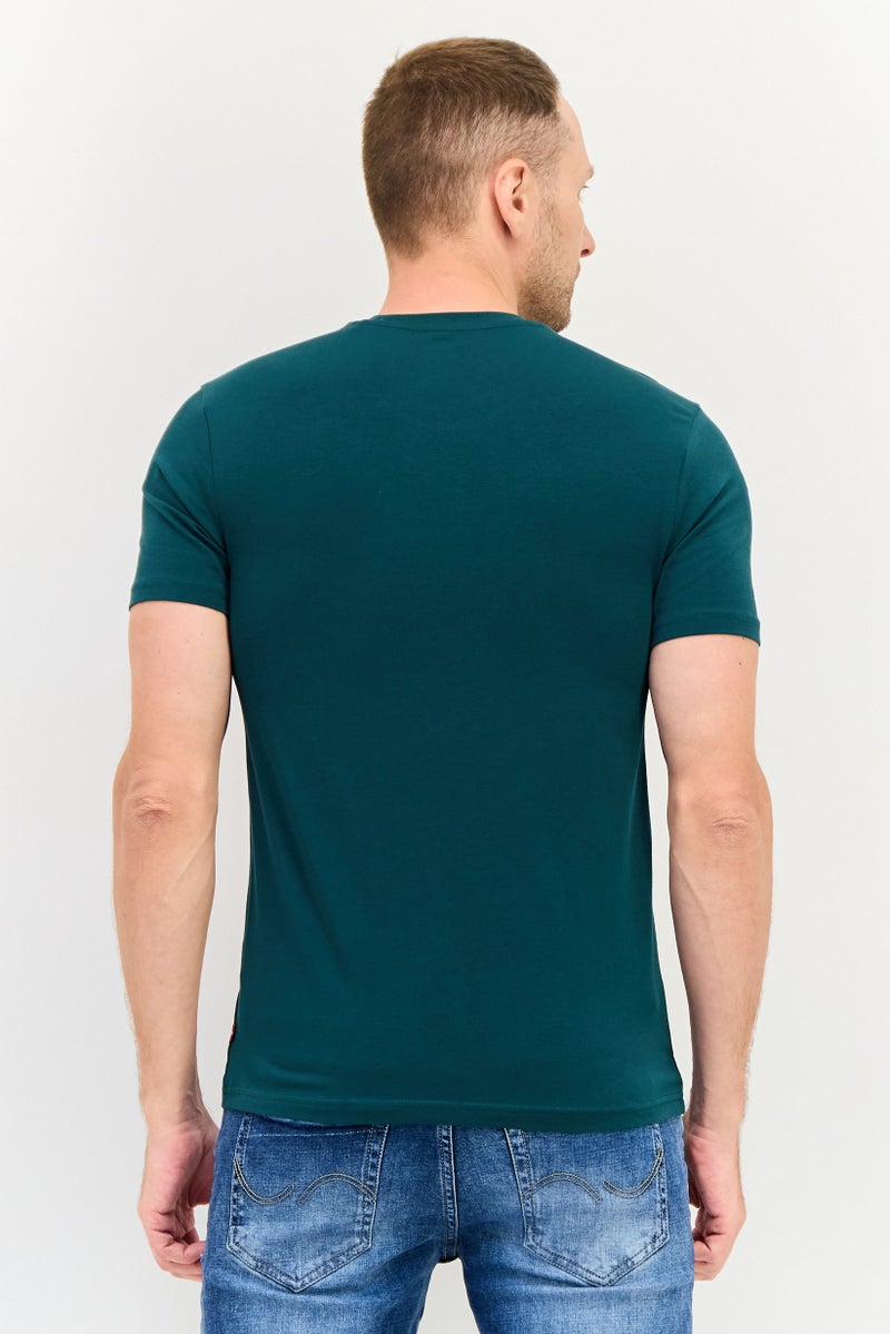 Levi's تي شيرت رجالي بأكمام قصيرة وياقة دائرية، طباعة جرافيك، أخضر داكن - Image 3