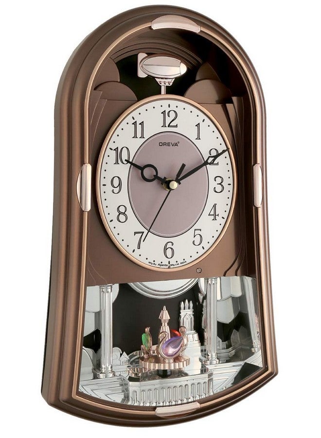 OREVA ساعة حائط أوريفا AQ-2187 بلاستيكية دوارة/متأرجحة وموسيقية (24.0 سم × 8.2 سم × 39.8 سم، كولا) - Image 2