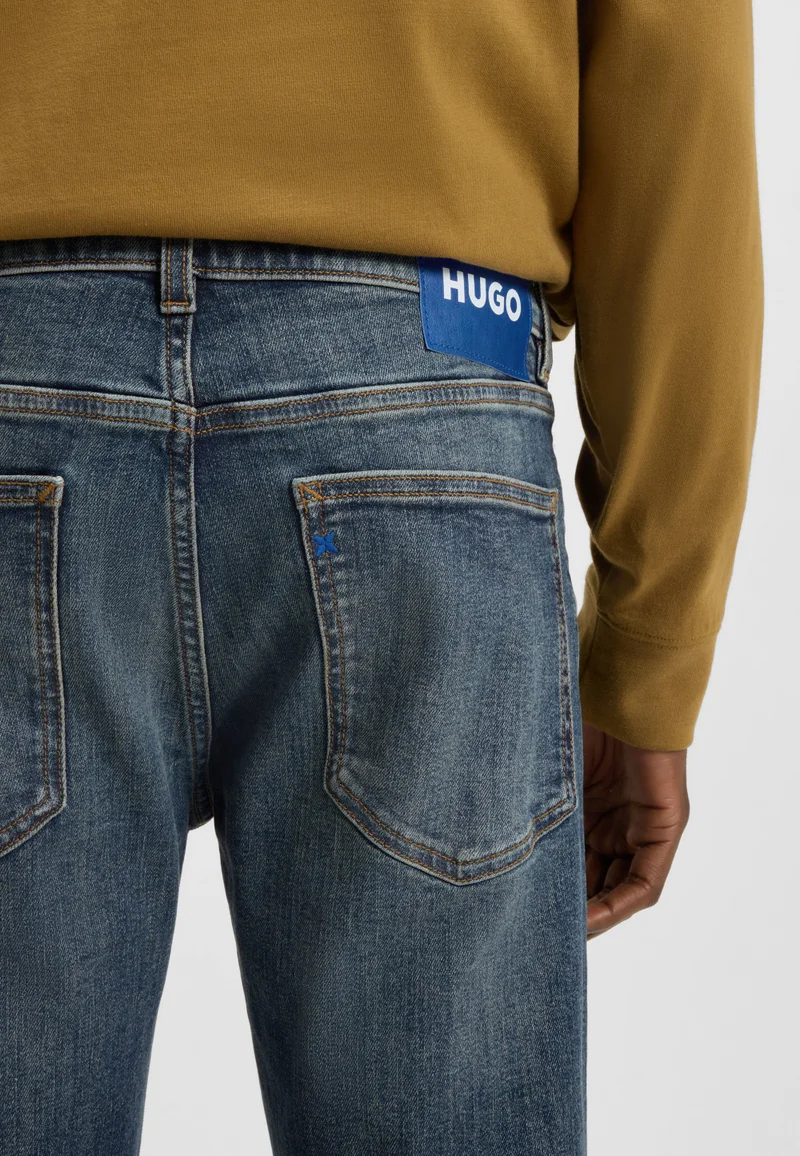 هوجو جينز بقصة ضيقة جداً من دنيم مطاطي أزرق داكن