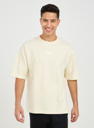 Oversized Silicon Badge Detail Terry T-Shirt - pzsku/Z0AE3DD4B5D4946E50DADZ/45/_/1707814857/30f85824-0b22-4f54-8c4f-bec006c7803f