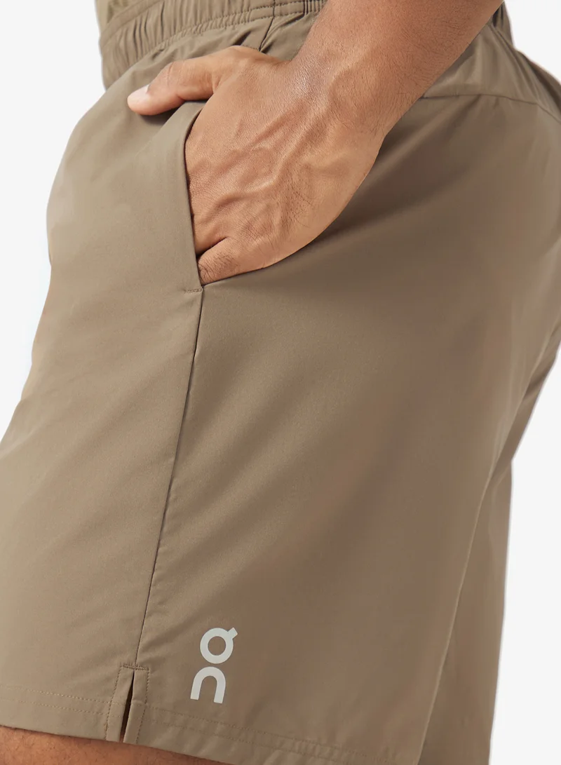 On Running  7" Essential Logo Core Shorts for Men | Best Price UAE