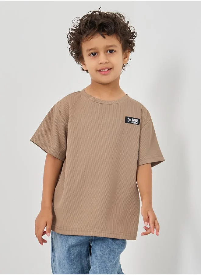 ستايلي Styli Textured Round Neck T-Shirt with Badge Detail